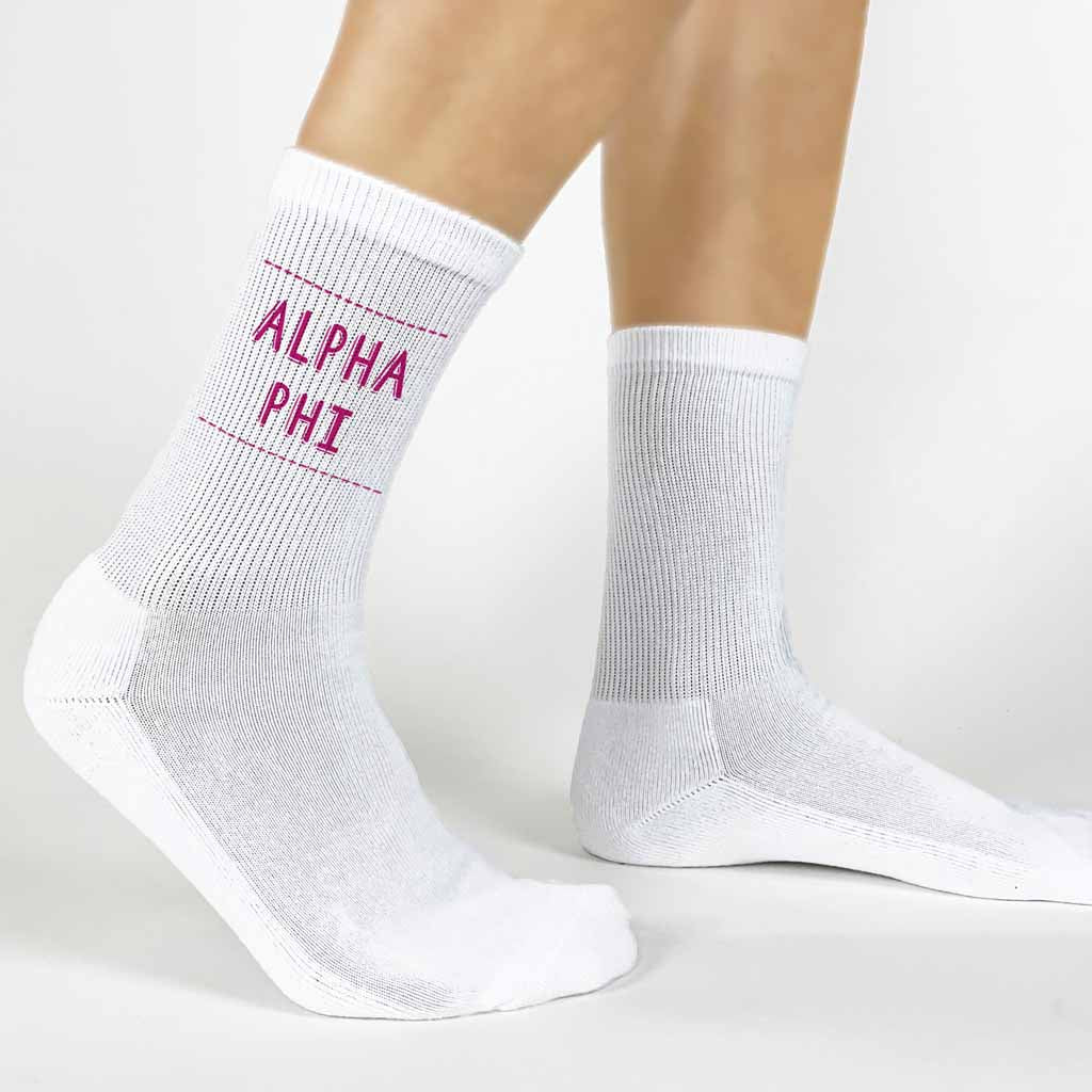 Highlight your Alpha Phi pride with a pair of these Alpha Phi crew socks printed in sorority colors. 