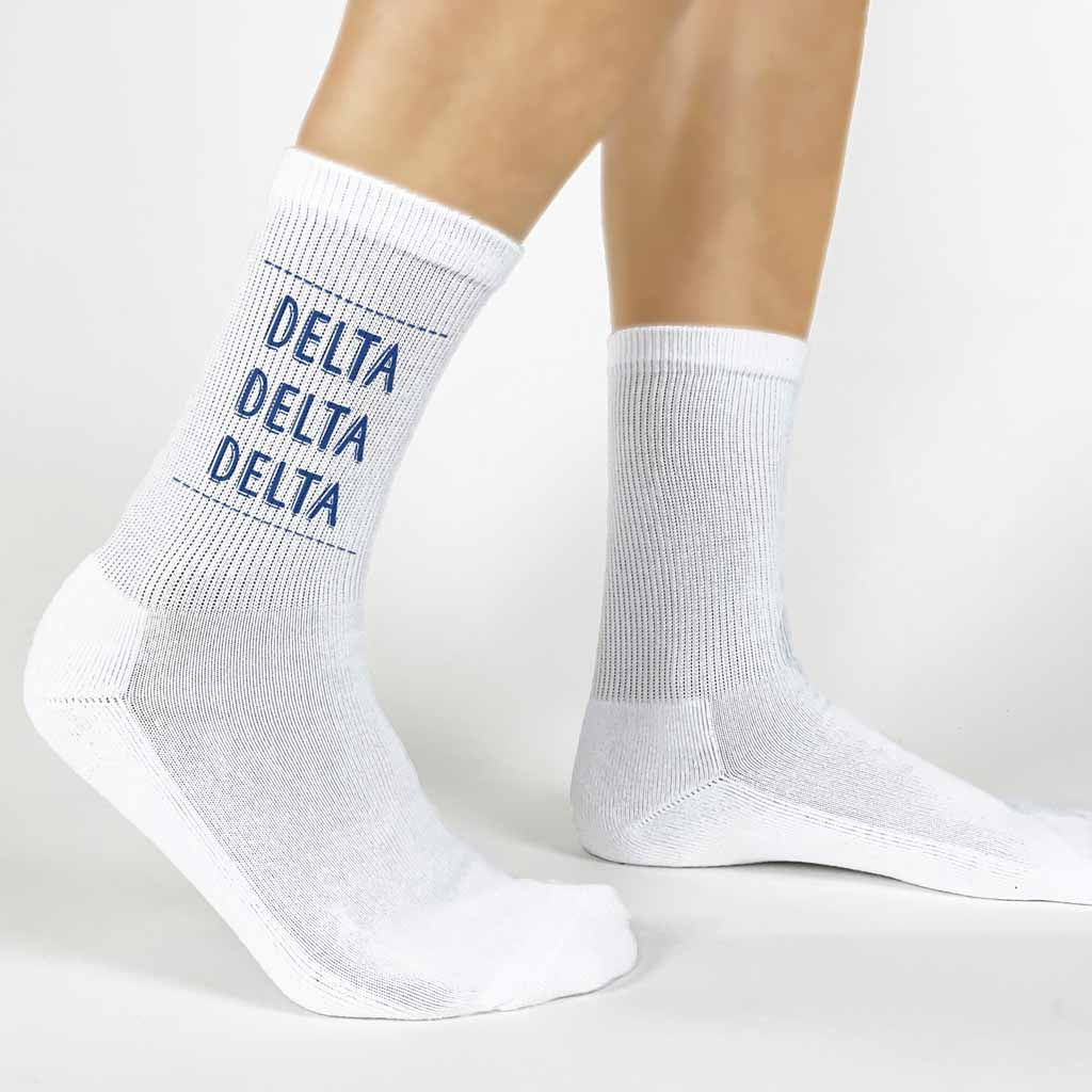 Highlight your Delta Delta Delta pride with a pair of these Delta Delta Delta white cotton crew socks printed in sorority colors. 