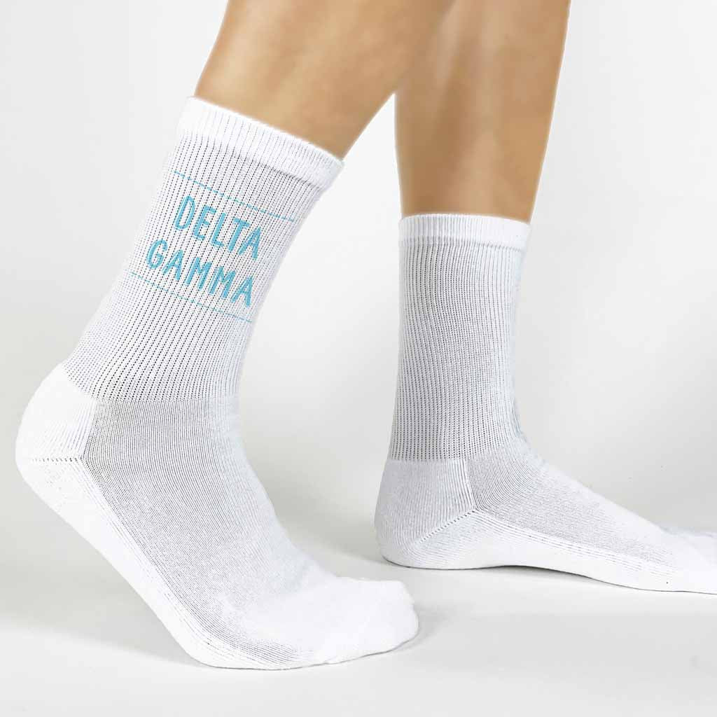 Highlight your Delta Gamma pride with a pair of these Delta Gamma white cotton crew socks printed in sorority colors. 