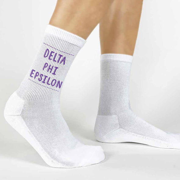 Highlight your Delta Phi Epsilon pride with a pair of these Delta Phi Epsilon white cotton crew socks printed in sorority colors. 