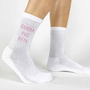 Highlight your Gamma Phi Beta pride with a pair of these Gamma Phi Beta white cotton crew socks printed in sorority colors. 