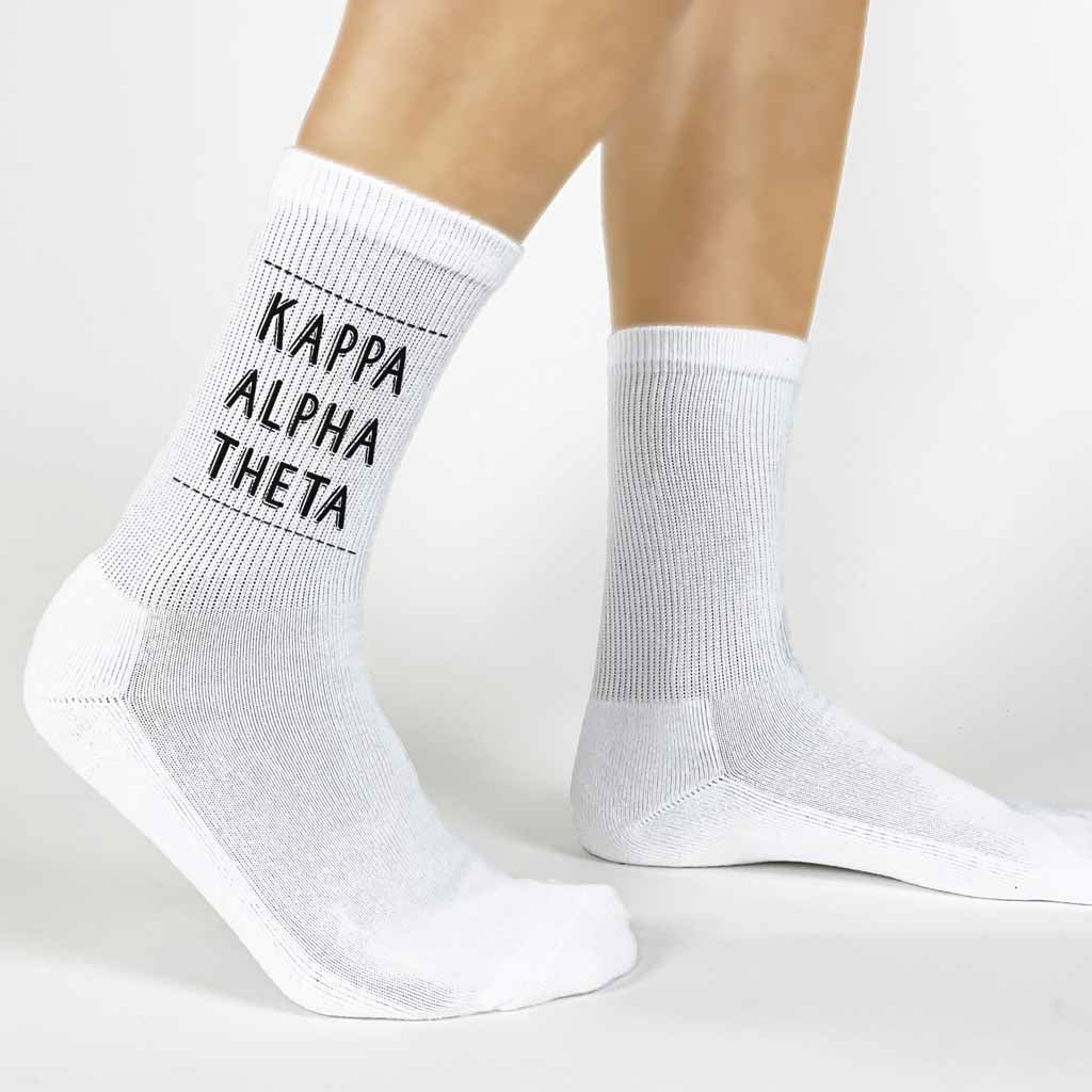 Highlight your Kappa Alpha Theta pride with a pair of these Kappa Alpha Theta white cotton crew socks printed in sorority colors. 