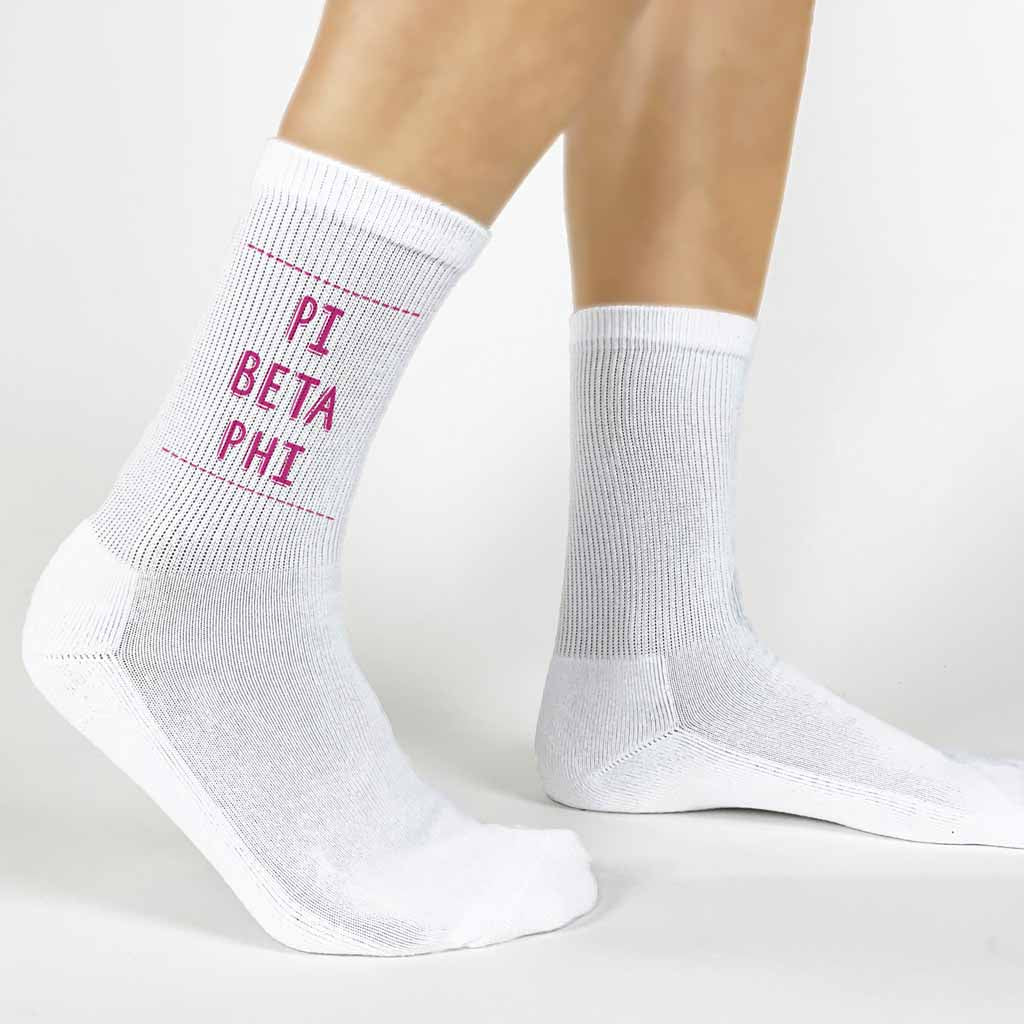 Highlight your Pi Beta Phi pride with a pair of these Pi Beta Phi white cotton crew socks printed in sorority colors. 