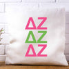 DZ sorority letters x3 in sorority colors custom printed on white or natural cotton throw pillow cover.