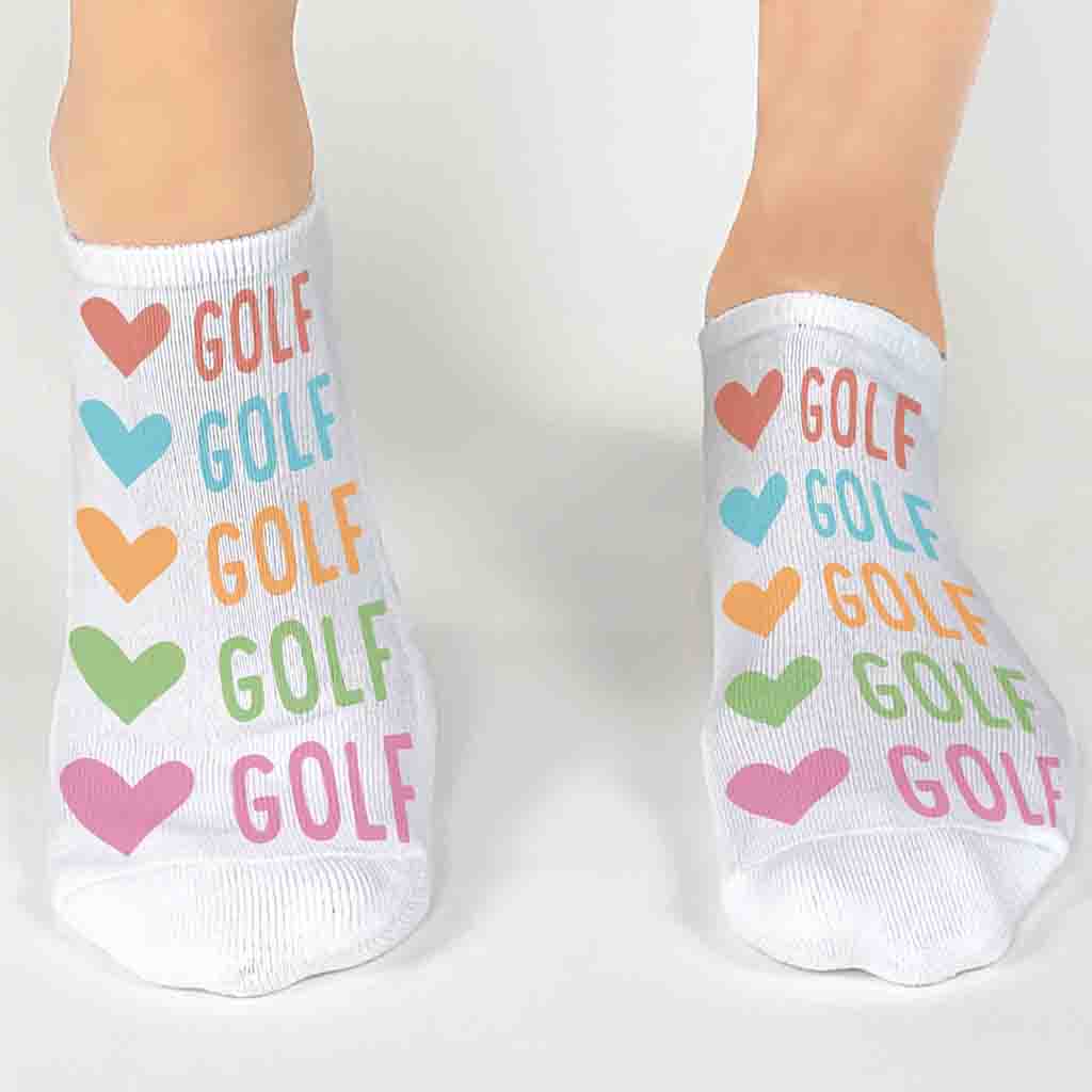 Soft and comfy white cotton blend no show socks digitally printed with colorful hearts and golf design on the top of the socks.