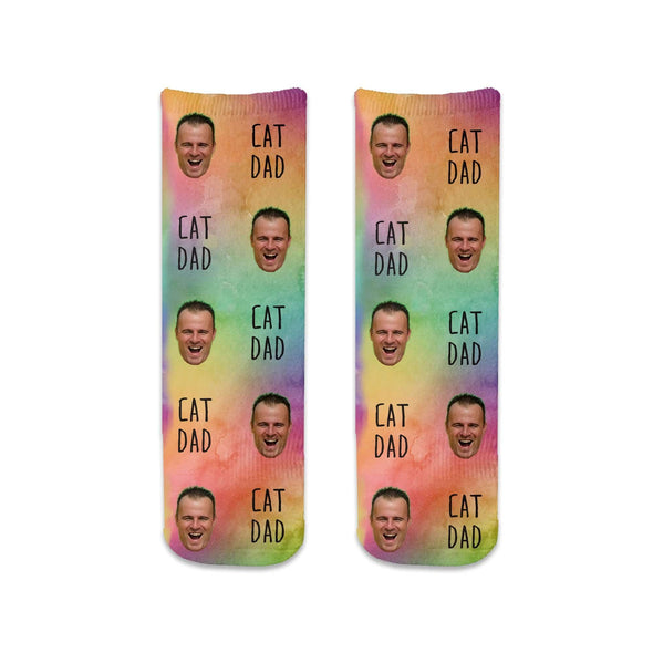 Super cute rainbow wash background design with a photo face and cat Dad text digitally printed on short crew socks.