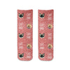 Red granular background design with a photo face and text digitally printed in a full print on short crew socks.