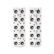 Add your own unique custom photo to unisex adult cotton crew socks with all over heart design shown on the white background.