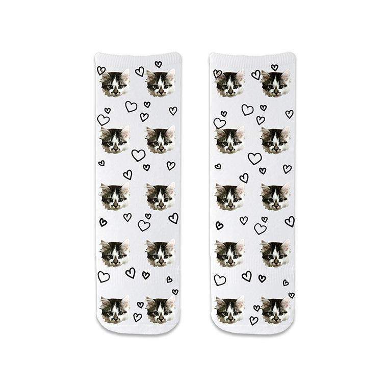 Add your own unique custom photo to unisex adult cotton crew socks with all over heart design shown on the white background.