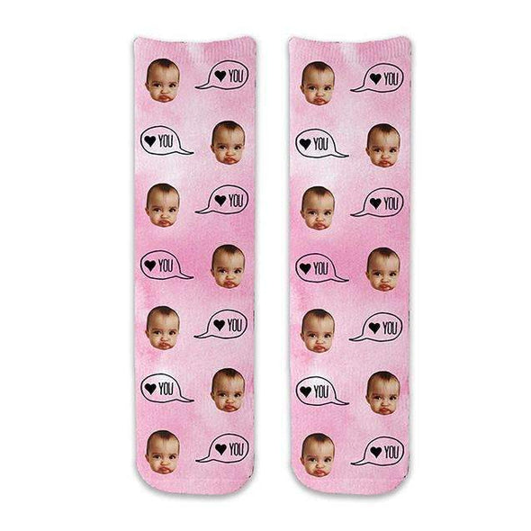 Super cute full print design on a pink wash background digitally printed in ink personalized using your own photo face cropped into the design and text that says heart you or meow or paws digitally printed on cotton crew socks.