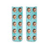 Custom printed photo face socks personalized using your own photos we crop the image and digitally print in repeat design on a background of your choice printed in ink on cotton crew socks.