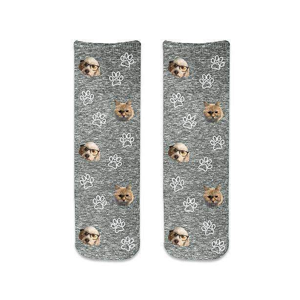 Black granular background design with cute custom photo faces using your photos cropped into the design and printed all over with paw prints on cotton crew socks.