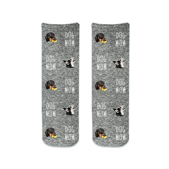 Dog mom socks custom printed on cotton crew socks with a black granular background personalized using your photo cropped in and dog mom text digitally printed on the design.