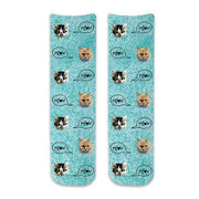Custom printed cat face photo socks using your own photos printed in all over design on turquoise wash background and meow text bubble digitally printed on cotton crew socks.