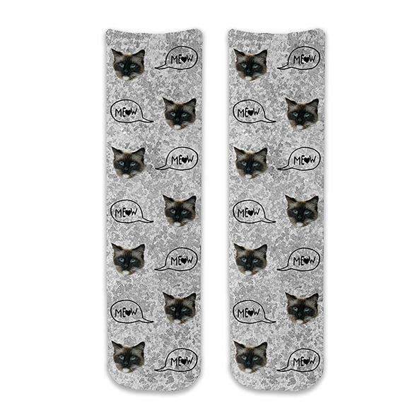 Custom printed cat face photo socks using your own photos printed in all over design on gray wash background and meow text bubble digitally printed on cotton crew socks.