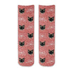 Custom printed cat face photo socks using your own photos printed in all over design on red granular background and meow text bubble digitally printed on cotton crew socks.