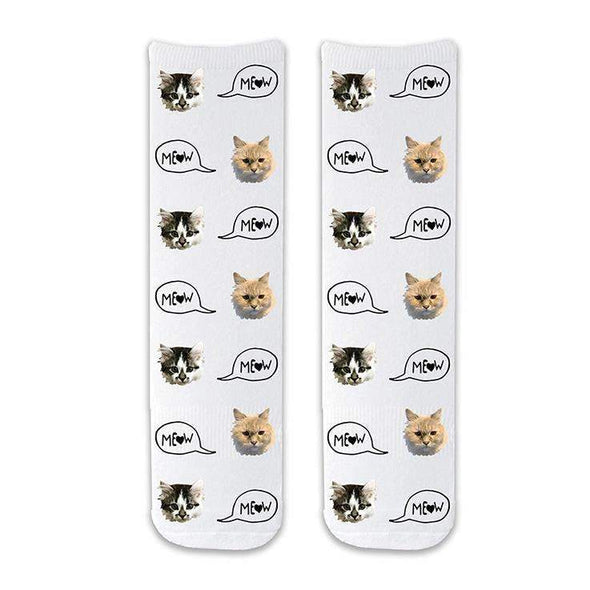 Custom printed cat face photo socks using your own photos printed in all over design on white background and meow text bubble digitally printed on cotton crew socks.