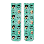 Personalize a pair of socks using your own photos of friends, family, or animals on a pair of custom designed photo socks printed on turquoise wash background on cotton crew socks.