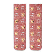 Custom printed photo face socks with an all over print of faces and you can personalize with a name digitally printed on red granular background on cotton crew socks.