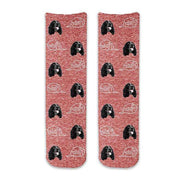 Cute dog face photo socks custom printed on red granular background and personalized using your own photo faces cropped in and printed all over the cotton crew socks make a unique gift idea.