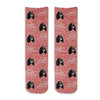 Cute dog face photo socks custom printed on red granular background and personalized using your own photo faces cropped in and printed all over the cotton crew socks make a unique gift idea.