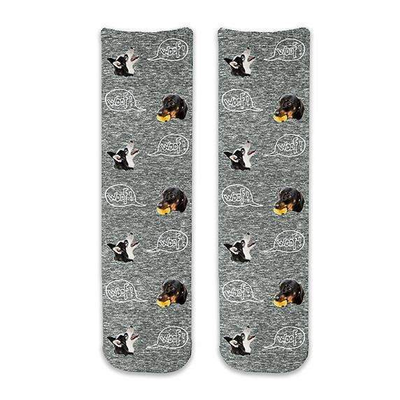 Cute dog face socks custom printed with the word woof on cotton crew socks digitally printed with a black granular background.