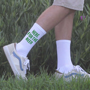 I'm here for the beer digitally printed in green ink on white cotton crew socks.