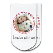 Super cute custom printed white cotton footie no show socks digitally printed with it was love at first bark text and hearts circle design personalized with your photo digitally printed to make a unique pair of socks.