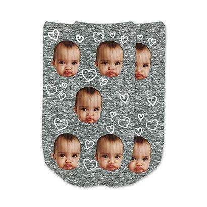 A heart design with dark gray granular background digitally printed on cotton no show footie socks personalized using your own photo printed on the top of the socks.