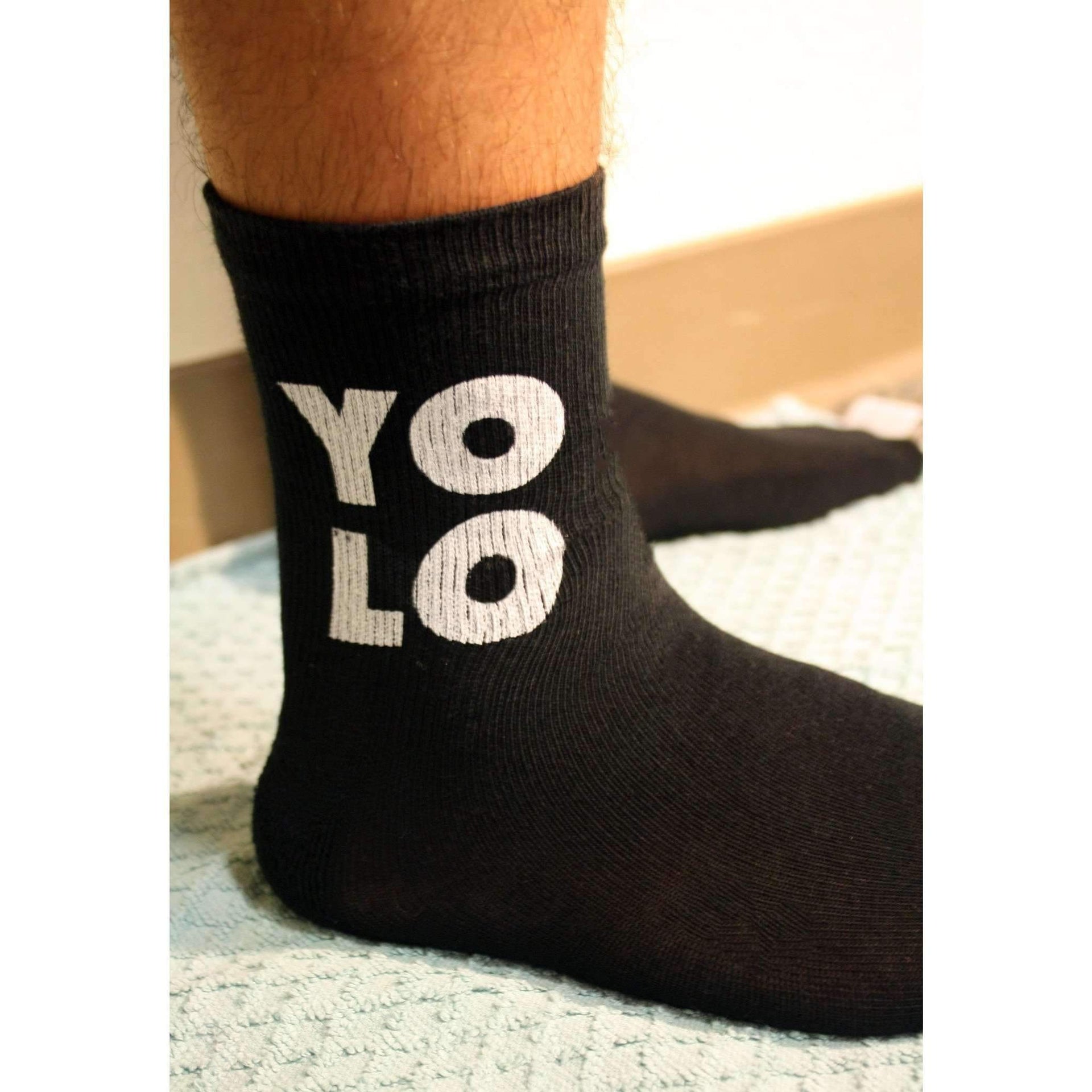 YOLO digitally printed in white ink on black cotton crew socks makes a great gift idea.